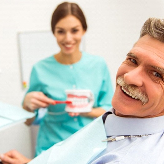 senior man at a dentures consultation