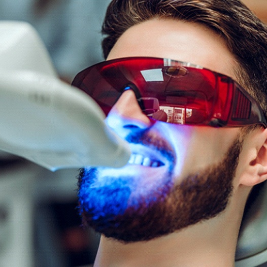 young man getting teeth whitening in Pensacola
